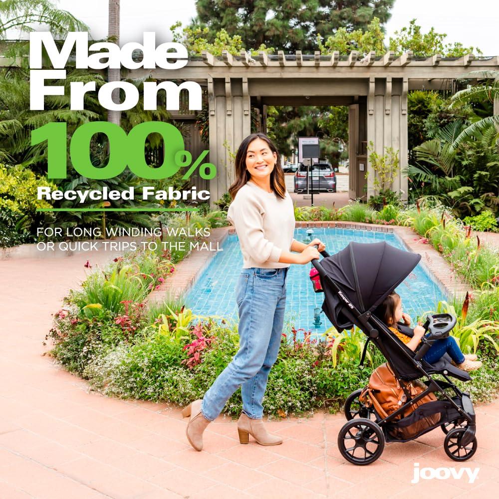 imageJoovy Kooper Lightweight Baby Stroller Featuring Removable SwingOpen Tray Big Wheels Reclining Seat with Footrest ExtraLarge Retractable Canopy and Compact Fold SandBlack