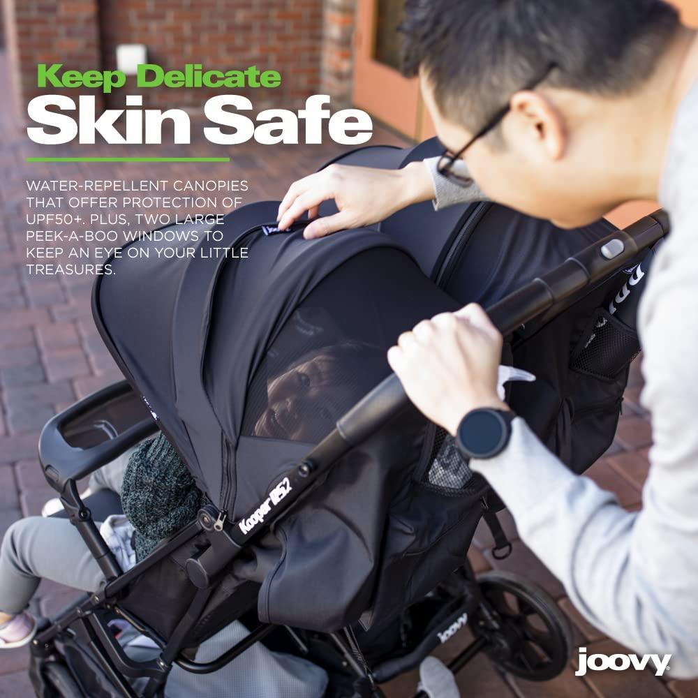 imageJoovy Kooper Lightweight Baby Stroller Featuring Removable SwingOpen Tray Big Wheels Reclining Seat with Footrest ExtraLarge Retractable Canopy and Compact Fold SandBlack