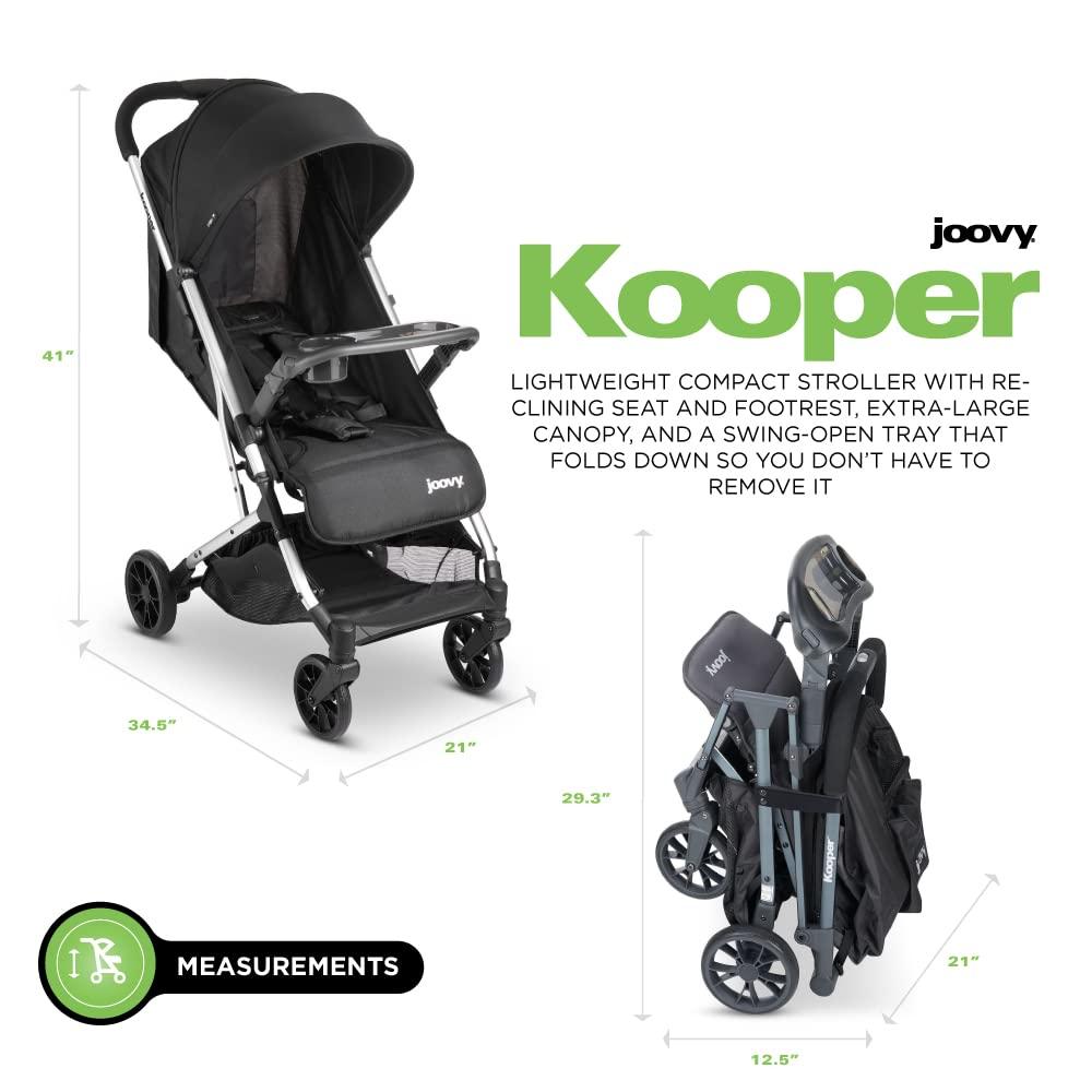 imageJoovy Kooper Lightweight Baby Stroller Featuring Removable SwingOpen Tray Big Wheels Reclining Seat with Footrest ExtraLarge Retractable Canopy and Compact Fold SandBlack