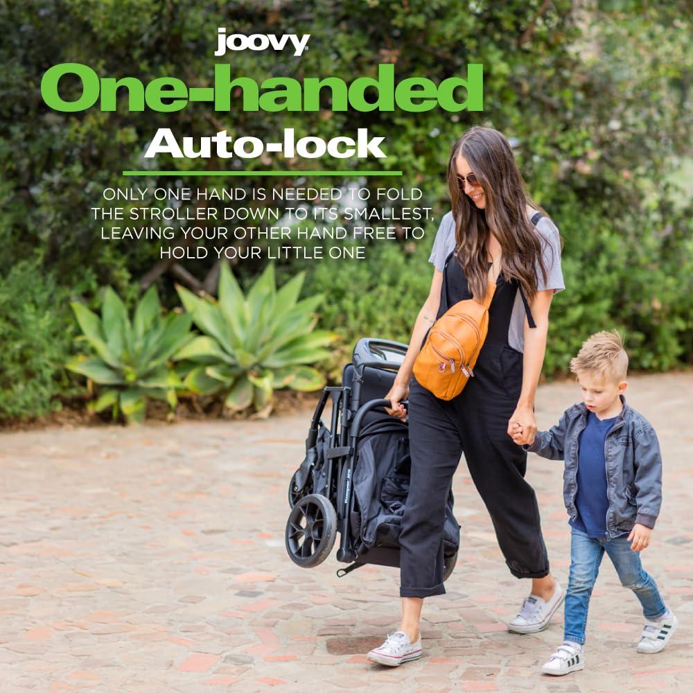 imageJoovy Kooper Lightweight Baby Stroller Featuring Removable SwingOpen Tray Big Wheels Reclining Seat with Footrest ExtraLarge Retractable Canopy and Compact Fold SandBlack