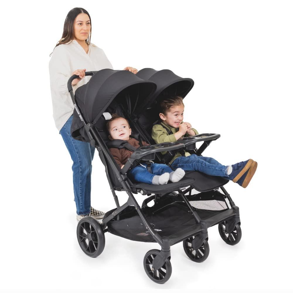 imageJoovy Kooper Lightweight Baby Stroller Featuring Removable SwingOpen Tray Big Wheels Reclining Seat with Footrest ExtraLarge Retractable Canopy and Compact Fold SandBlack